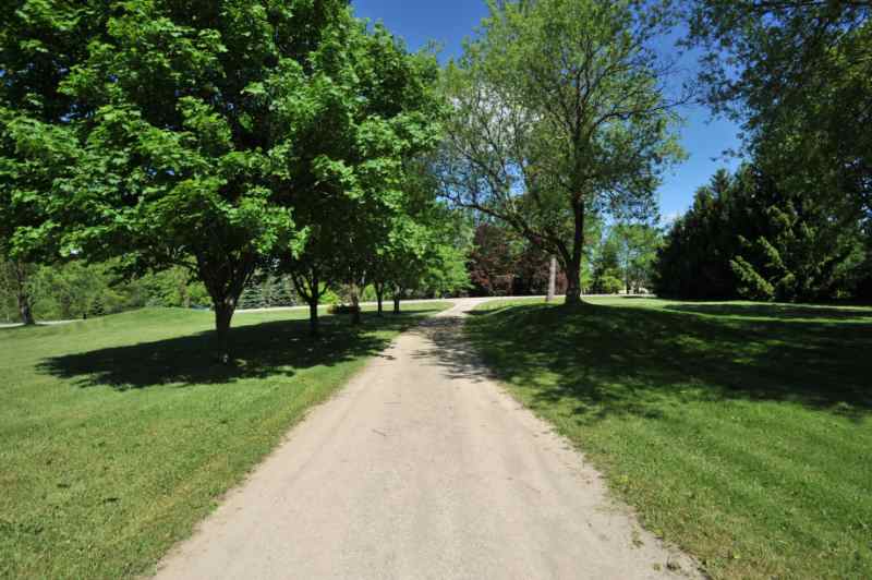 2 Car garage, Maple Tree-lined Driveway, Park-like Setting