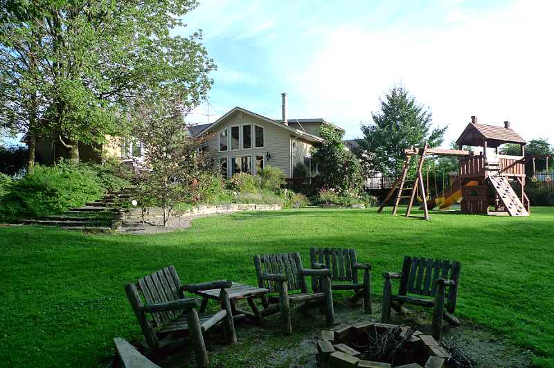 Perennial gardens, flagstone patio & walkways, firepit