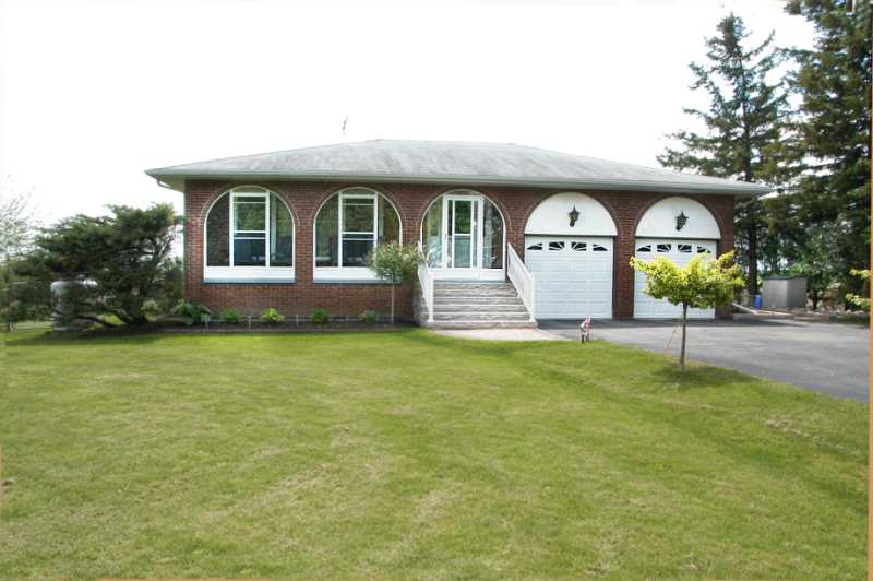 enclosed front porch, landscaped, half acre, caledon