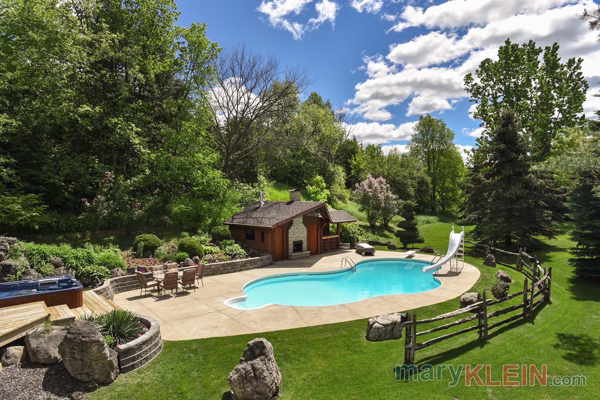 oasis, inground pool, hot tub, outdoor fireplace