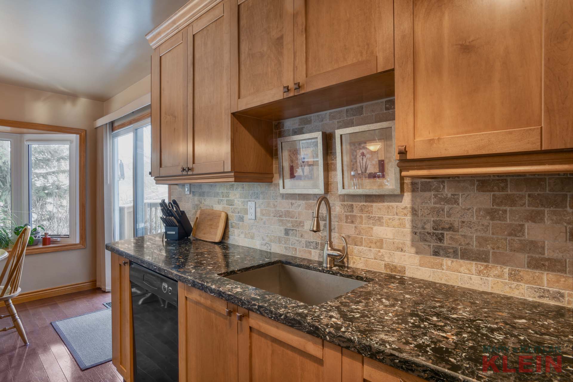 Quartz Counters , stone backsplash, maple kitchen 