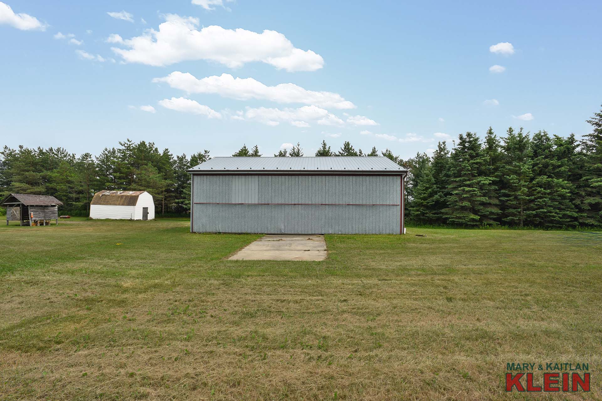 airplane hangar, pilots, grass landing strip 