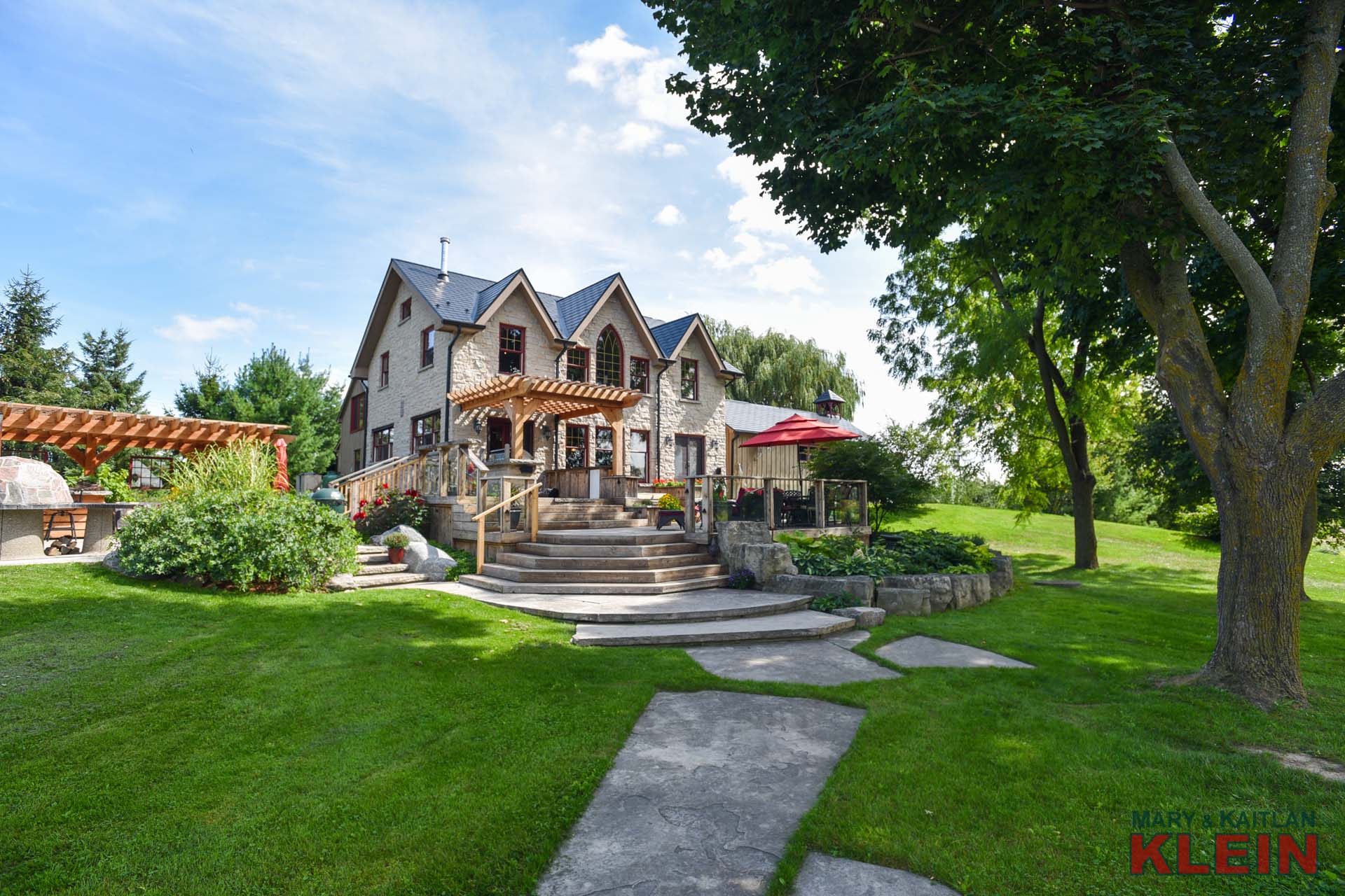 Stone Walkways, Perennial Gardens, Steel Roof. Outdoor Landscaping 